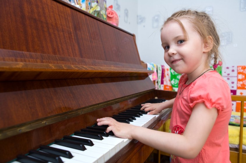 Girl mastered piano at home